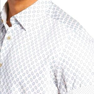 White shirt with light blue oval shape design